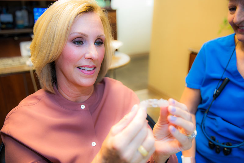 an orthodontic patient being fitted for clearcorrect clear aligners.